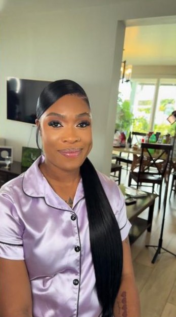 Sleek low ponytail with a side swoop